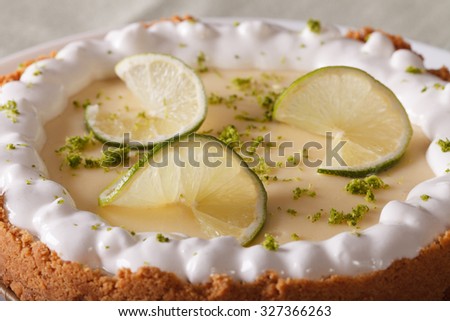Delicious lime cake with whipped cream and zest closeup. horizontal 
