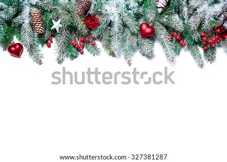 Christmas Border. Tree branches with baubles, stars, snowflakes isolated on white