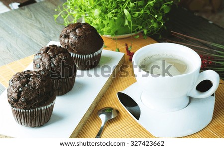 Chocolate brownie  and cup of coffee. Breakfast with freshly brewed coffee and brownie on the wooden table natural background. 