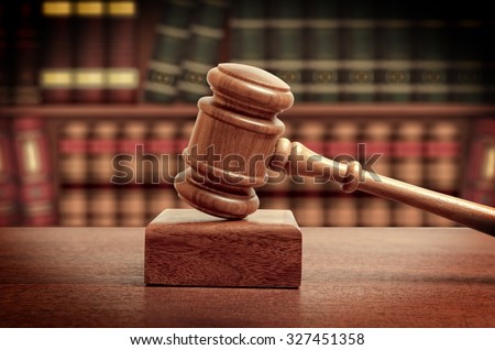 The gavel of a judge in court Royalty-Free Stock Photo #327451358