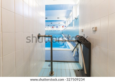 Entrance to the pool,  with electronic turnstile. 
