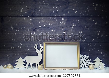 Vintage Christmas Card With Picture Frame On White Snow. Copy Space For Advertisement. White Christmas Decoration Like Snowflakes, Tree, Golden Balls And Reindeer. Shabby Chic Wooden Background