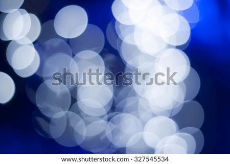 Defocused bokeh lights over blur background.