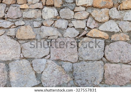 Old stone masonry of granite, grunge background