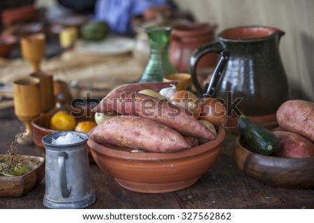medieval food and crockery  Royalty-Free Stock Photo #327562862