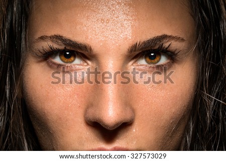Conviction focused determined passionate confident powerful eyes stare intense athlete exercise trainer Royalty-Free Stock Photo #327573029