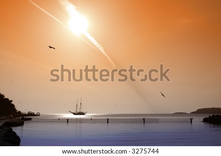 Fireball above a tranquil bay