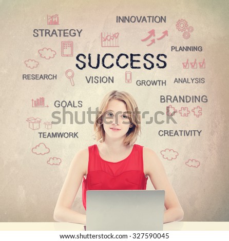 Success concept with young woman working on a laptop 