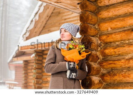  portrait of a  young woman near the house of Santa Claus