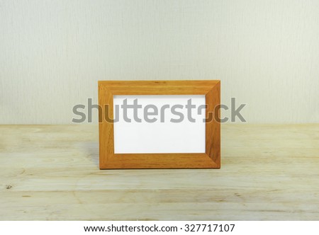 Blank silver picture frame at the desk
