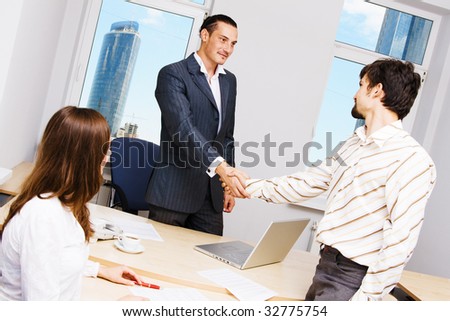 Handshake illustrating successful cooperation with a partner or customer