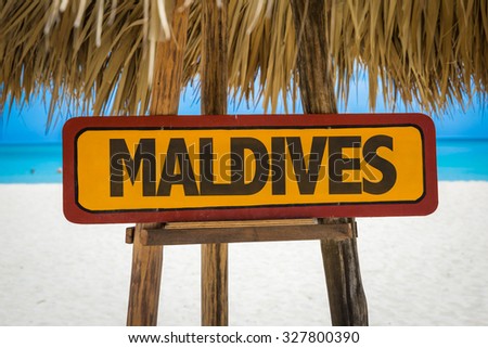 Maldives sign with beach background