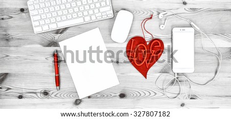 Office Workplace with Red Heart, Keyboard, Phone, Headphones, Stationary and Office Supplies. Valentines Day concept with space for Your text and picture