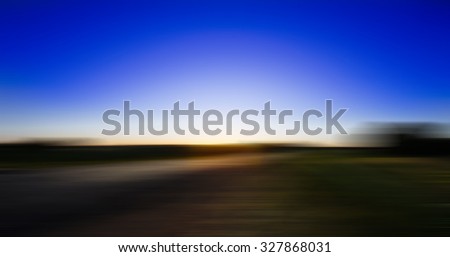 Blurred defocused motion effect on the asphalt road