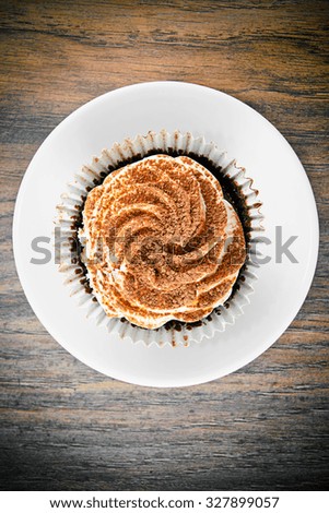 Cake with Cream, Cupcake on Woody Background.