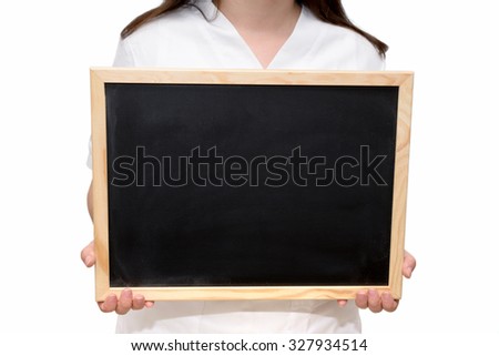 Female nurse holding a blank slate board, isolated on white background.
