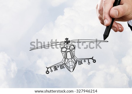 Person hand drawing helicopter model ob sky background