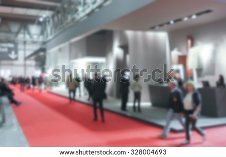 People generic background, trade show. Intentionally blurred post production.