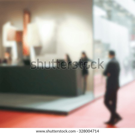 People generic background, trade show. Intentionally blurred post production.