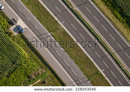 aerial view of highway in Summer time with green fields