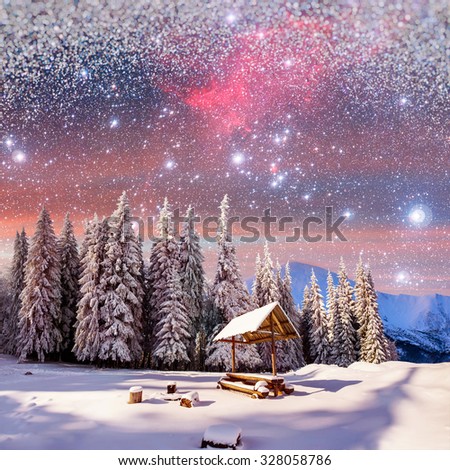 starry sky in a fantastic New Year's Eve. Winter background with some soft highlights and snow flakes