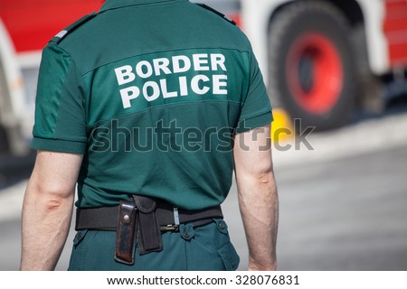 Closeup of a border police officer Royalty-Free Stock Photo #328076831