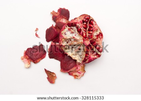 peeled pomegranate with crusts Royalty-Free Stock Photo #328115333