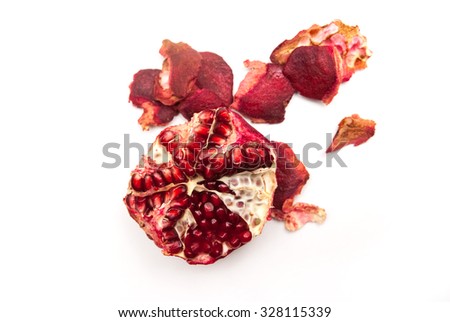 peeled pomegranate with crusts Royalty-Free Stock Photo #328115339
