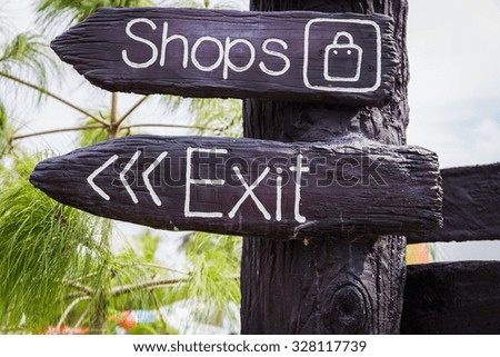 Sign with Exit text on wood plate
