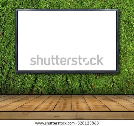 One big blank billboard attached to a ivy wall with wooden floor