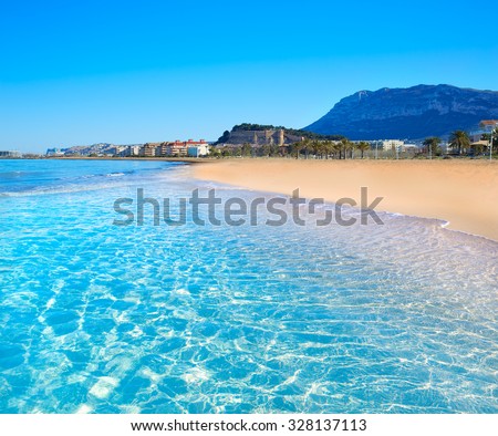 Denia beach in Alicante in blue Mediterranean with Montgo Alicante Royalty-Free Stock Photo #328137113