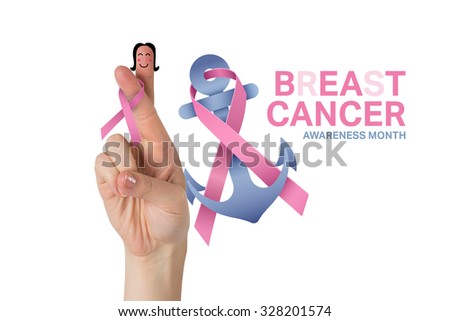 Crossed fingers with breast cancer ribbon against breast cancer awareness message