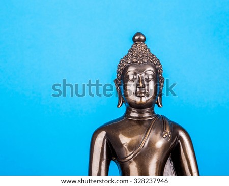 Buddha statue on blue background,statue in Buddhist Thailand ,  are public  domain  or treasure of Buddhism ,no restrict in copy or use . This photo  taken   these  conditions