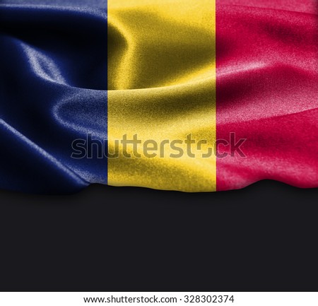 Romania flag on smooth silk texture Dark Background Space for Text
