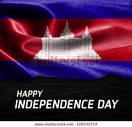 Happy Independence Day Cambodia flag on wood Texture background
