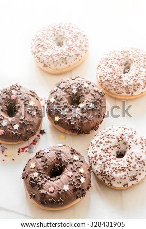 Dark and white chocolate American donuts on table,selective focus 