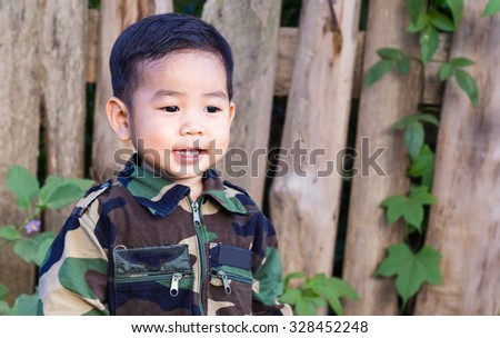 A boy in a military uniform