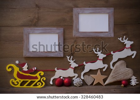 Christmas Card With Red Santa Claus, Yellow Sled And White Reindeer. Christmas Decoration Like Tree, Ball, Heart And Star. Shabby Chic Picture Frame With Copy Space. Brown Vintage Wooden Background.