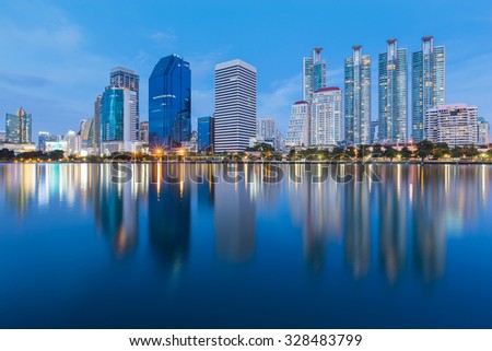 Beautiful twilight of city office water reflection 