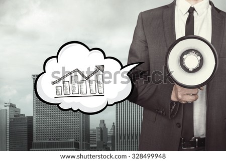 Graph on speech bubble with businessman and megaphone on city background 