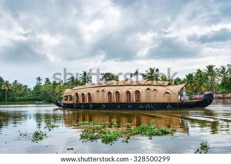 Traditional Indian houseboat near Alleppey  on Kerala backwaters, India Royalty-Free Stock Photo #328500299
