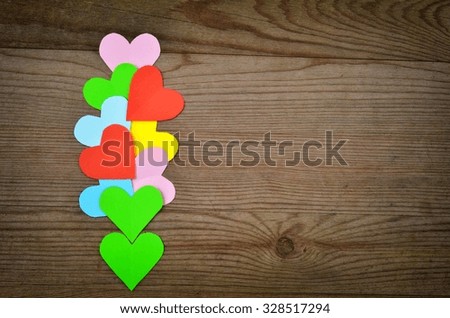Hearts on wooden background.