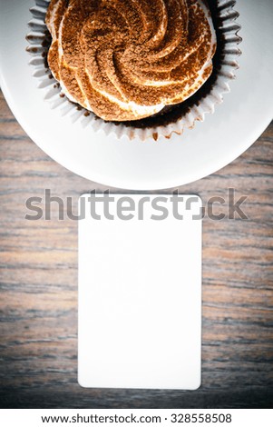Cake with Cream, Cupcake on Woody Background.