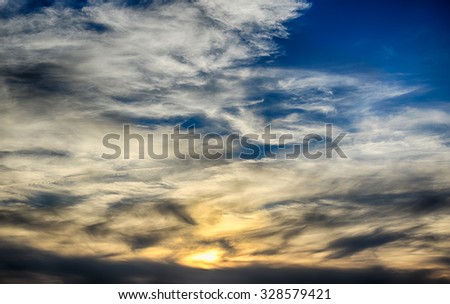 Natural background with red sunset and dark ominous clouds.HDR image