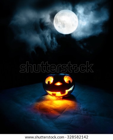 Single funny halloween pumpkin in moon light