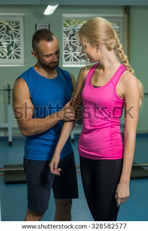 
Young couple in the gym. Mutual support and assistance in the exercises. Work on your body. Photos for sporting and social magazines and websites.
