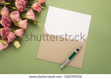 Flowers, envelope and pen 
