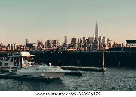 Manhattan downtown skyline with urban skyscrapers and boat