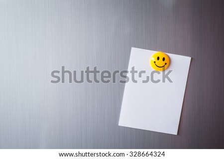 Empty paper sheet on refrigerator door Royalty-Free Stock Photo #328664324