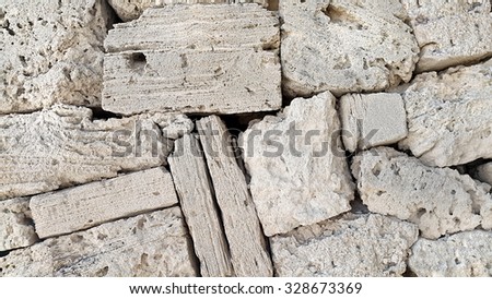 Texture of wall from different shapes stones